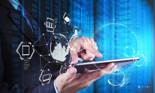 Double exposure of businessman shows modern technology as concept